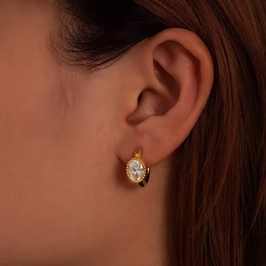 Oval white crystal earrings