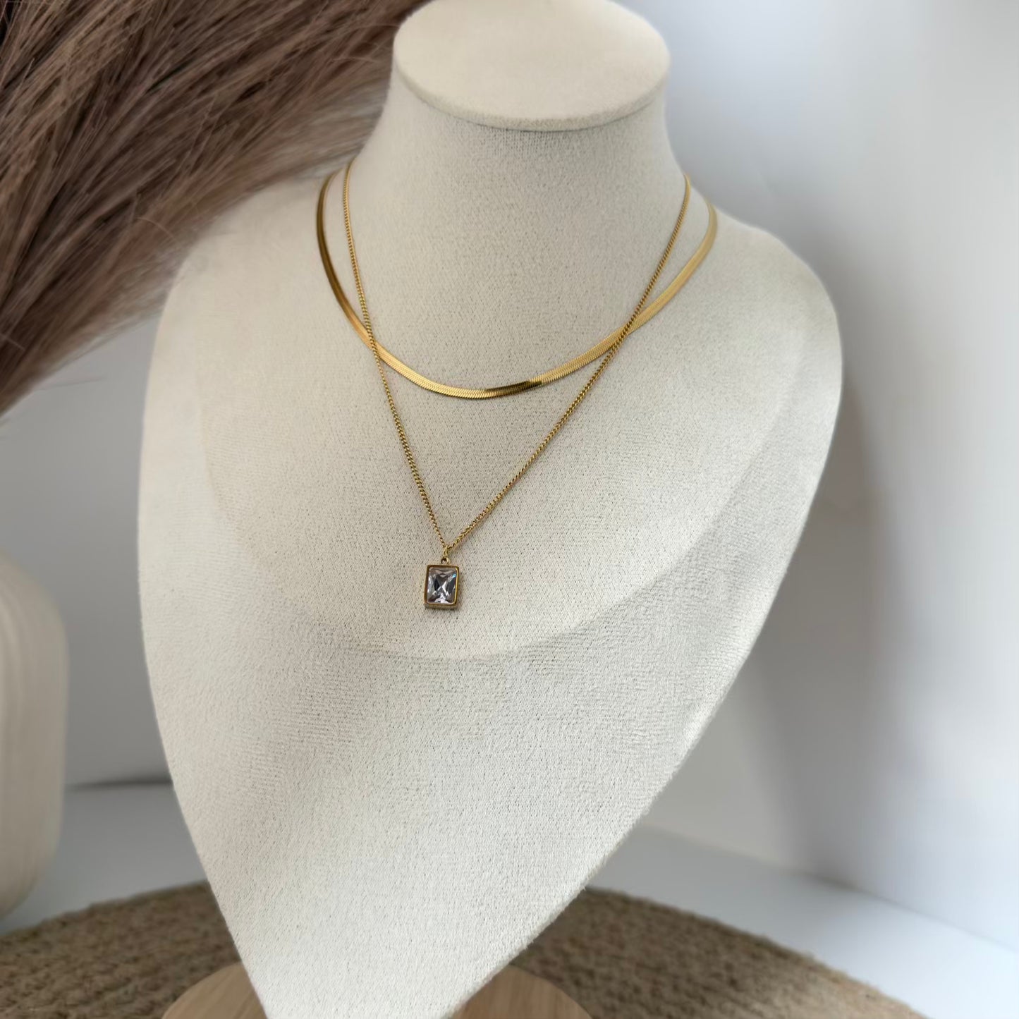 White crystal with snake chain layered necklace