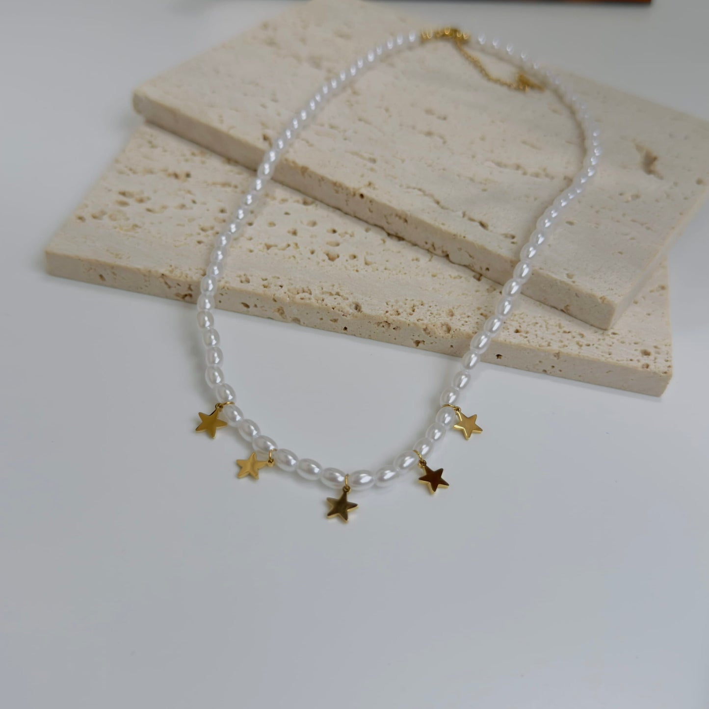 Star with pearl necklace