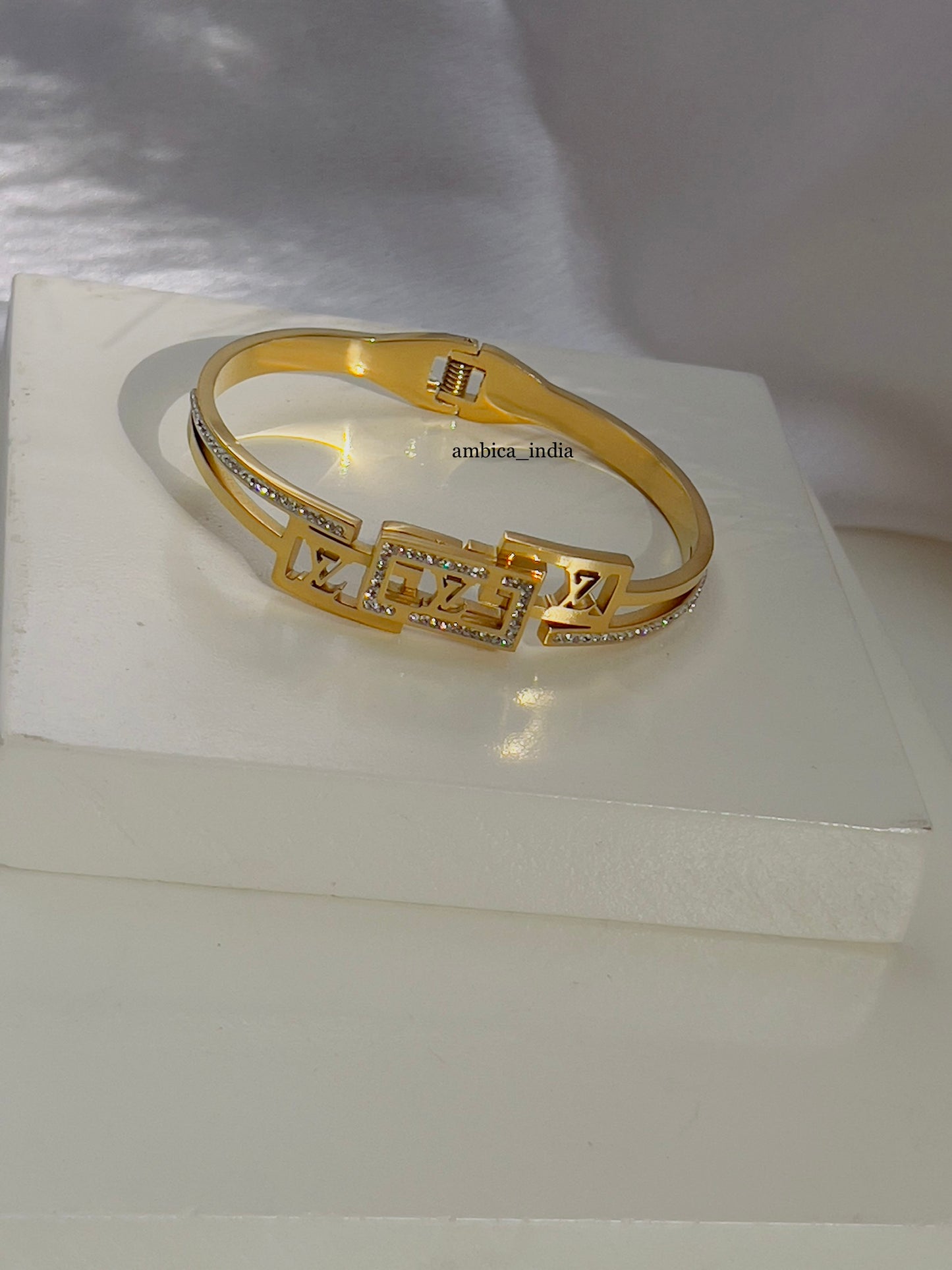 Lv with studded bracelet