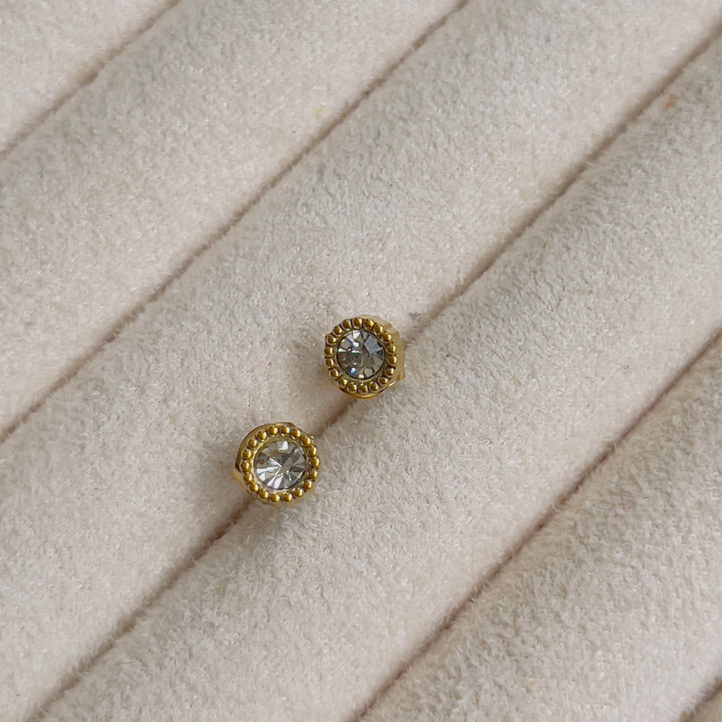 Tiny round white crystal earrings