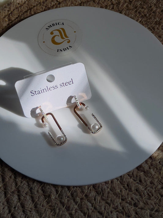 Perl with studded earrings