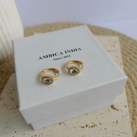 Oval white crystal earrings