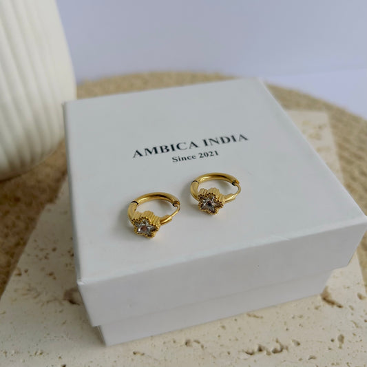 Star white crystal bezel huggie earrings