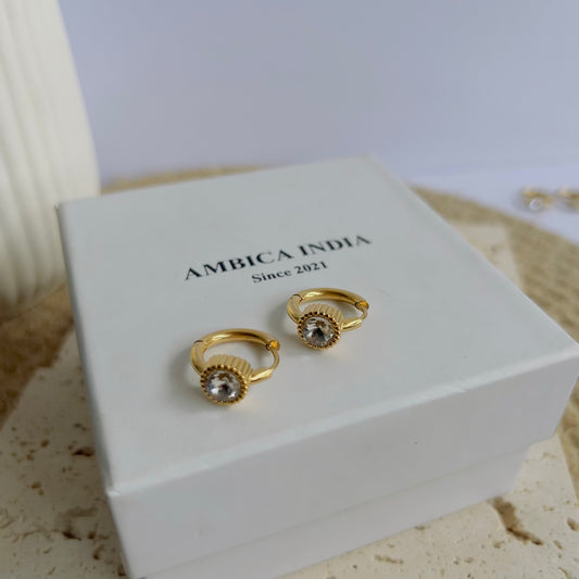 Round white crystal bezel huggie earrings