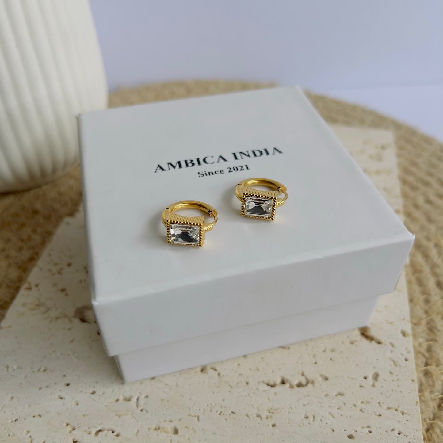 White crystal bezel huggie earrings