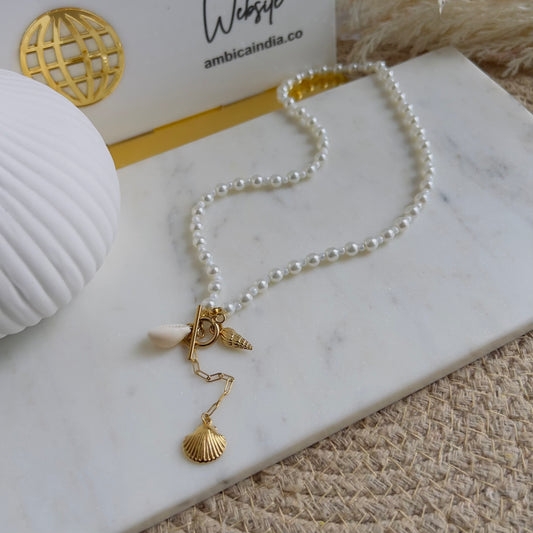 Pear with shell necklace