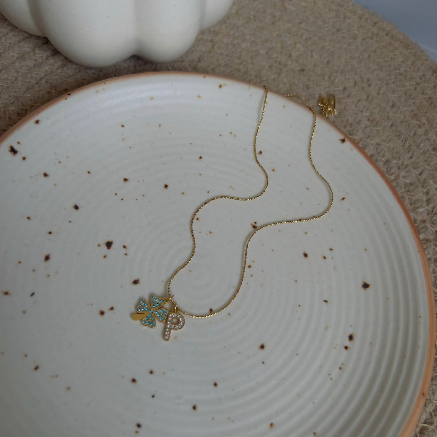 Initial P with flower necklace