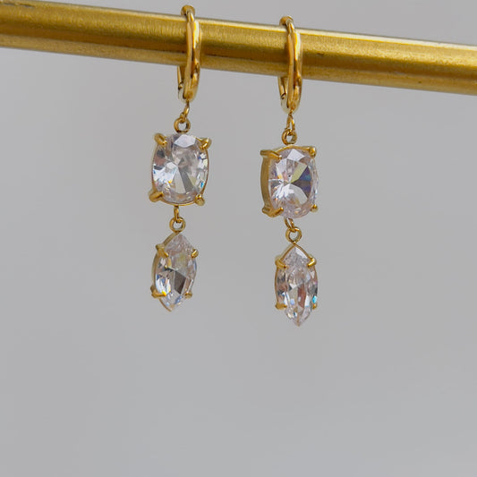 Oval white crystal earrings